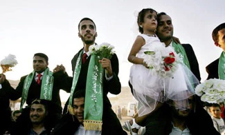 Hamas stages mass wedding in Gaza