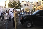 Palestinian people hurl shoes at US Ambassador