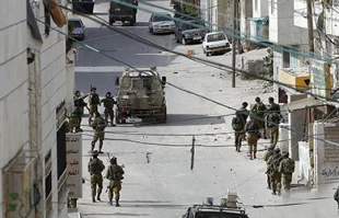 Israeli troopers withdraw from devastated occupied area