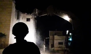 Israeli troopers withdraw from devastated occupied area
