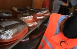 بالصور: الهلال الاحمر الايرانى يوزع ربع مليون وجبة افطار على الصائمين في قطاع غزة المحاصر 7