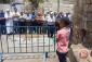 Palestinians continue praying outside Al-Aqsa compound