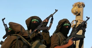 Qassam Brigades stage parade on Hamas founding anniv
