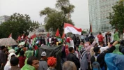 Despite heavy rain and flood, Indonesians protest against Tump's decision on al-Qods 3