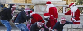 Photo Album: Israeli troops engage and arrest Santa protesters 2