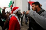 Photo Album: Israeli troops engage and arrest Santa protesters 3