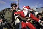 Photo Album: Israeli troops engage and arrest Santa protesters 5