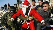 Photo Album: Israeli troops engage and arrest Santa protesters 6