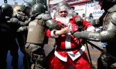 Photo Album: Israeli troops engage and arrest Santa protesters 7