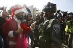 Photo Album: Israeli troops engage and arrest Santa protesters 8