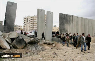 Palestinians broke down parts of Apartheid Wall