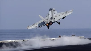'US-led jets flying over Syria amid looming threats of military strike'