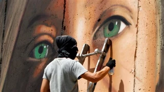 Israel detains Italian graffiti artists over Palestinian hero girl mural
