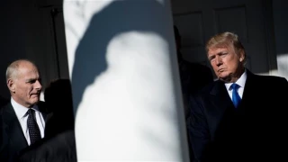 Despite full-throated defense at the time, Kelly backtracks on Trump’s Muslim ban