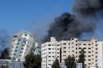 Israeli air strikes kill eight children and flatten Gaza building housing international media outlets 2
