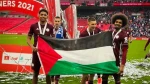 Hamza Choudhury and Wesley Fofana hold up Palestine flag during FA Cup celebrations