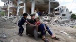 Palestinians in Gaza live by the rubble of their former homes
 6