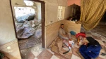 Palestinians in Gaza live by the rubble of their former homes
 8