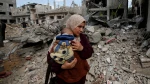 Palestinians in Gaza live by the rubble of their former homes
 9