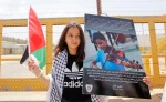 Palestinians demonstrate outside Ofer military camp in protest of a trial for a 14-year-old boy