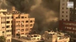 Israeli air strikes kill eight children and flatten Gaza building housing international media outlets 3
